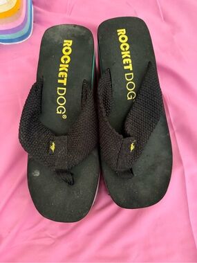 Rocket Dog Black Flip Flops with Yellow Logo